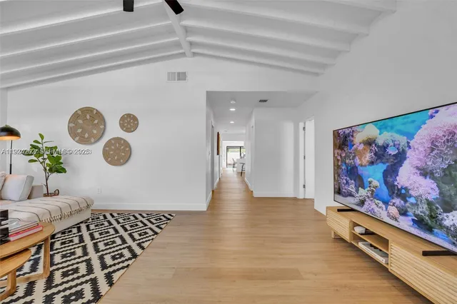 a view of entryway with furniture and wall paintings