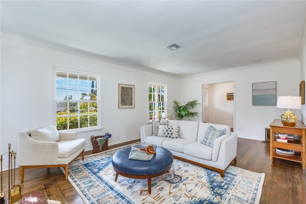 2091 West Mountain Street Glendale, CA 91201 - Photo 12 of 60 a living room with furniture a rug and a window