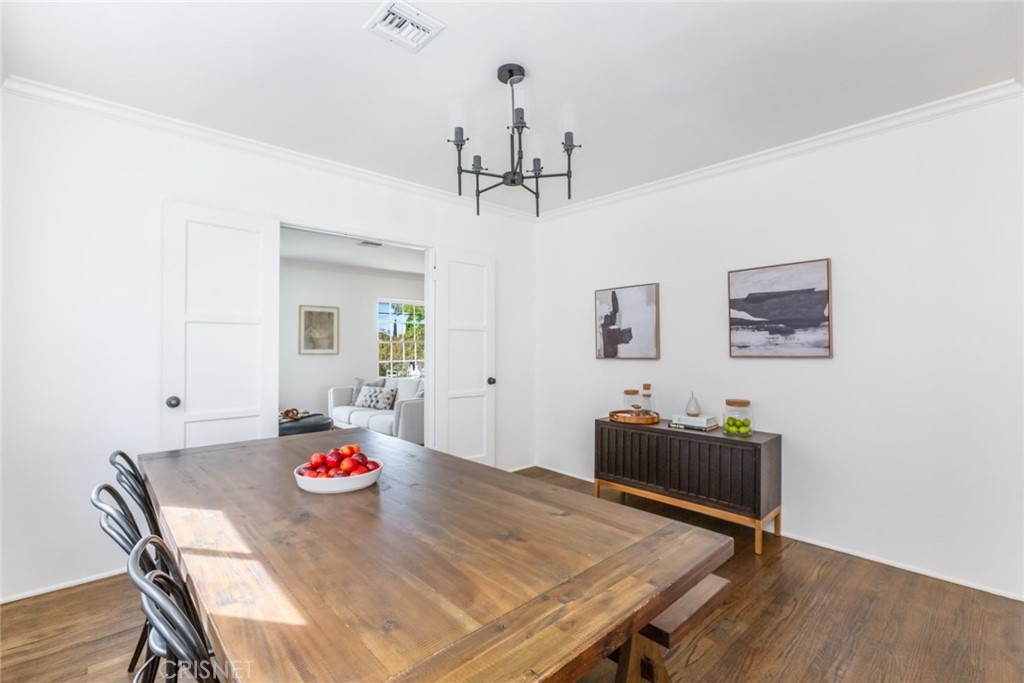 2091 West Mountain Street Glendale, CA 91201 - Photo 15 of 60 a view of a dining room with furniture and wooden floor