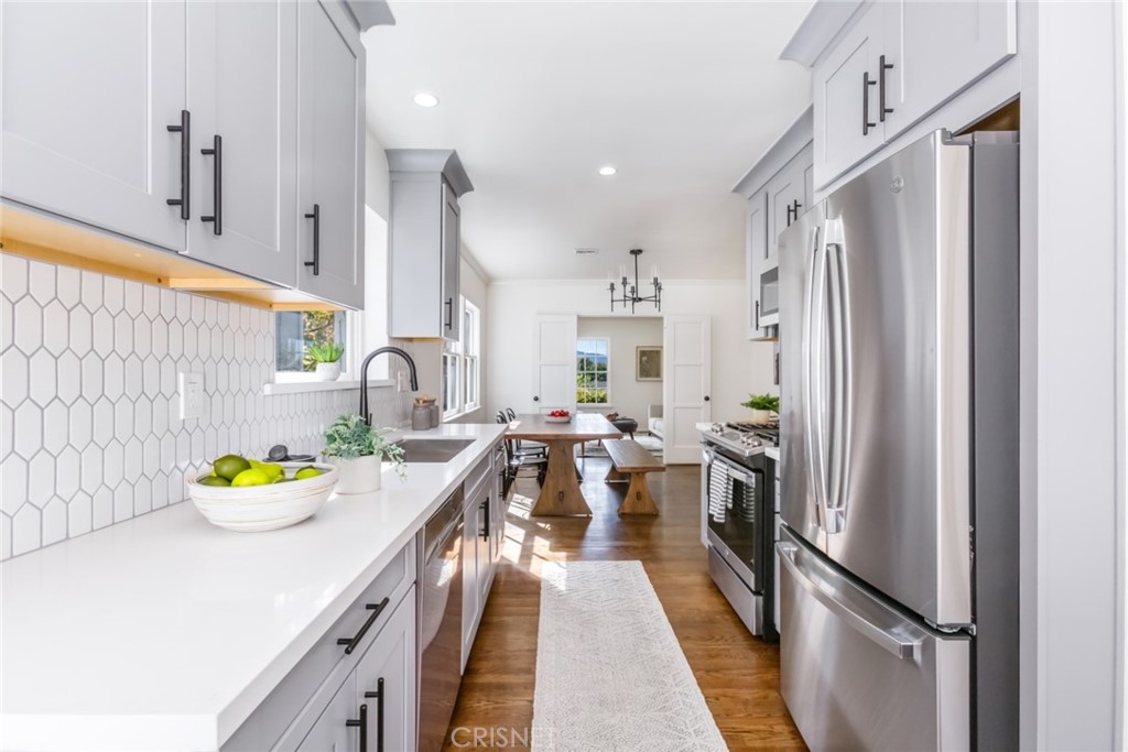 2091 West Mountain Street Glendale, CA 91201 - Photo 19 of 60 a kitchen with stainless steel appliances granite countertop a refrigerator and a sink