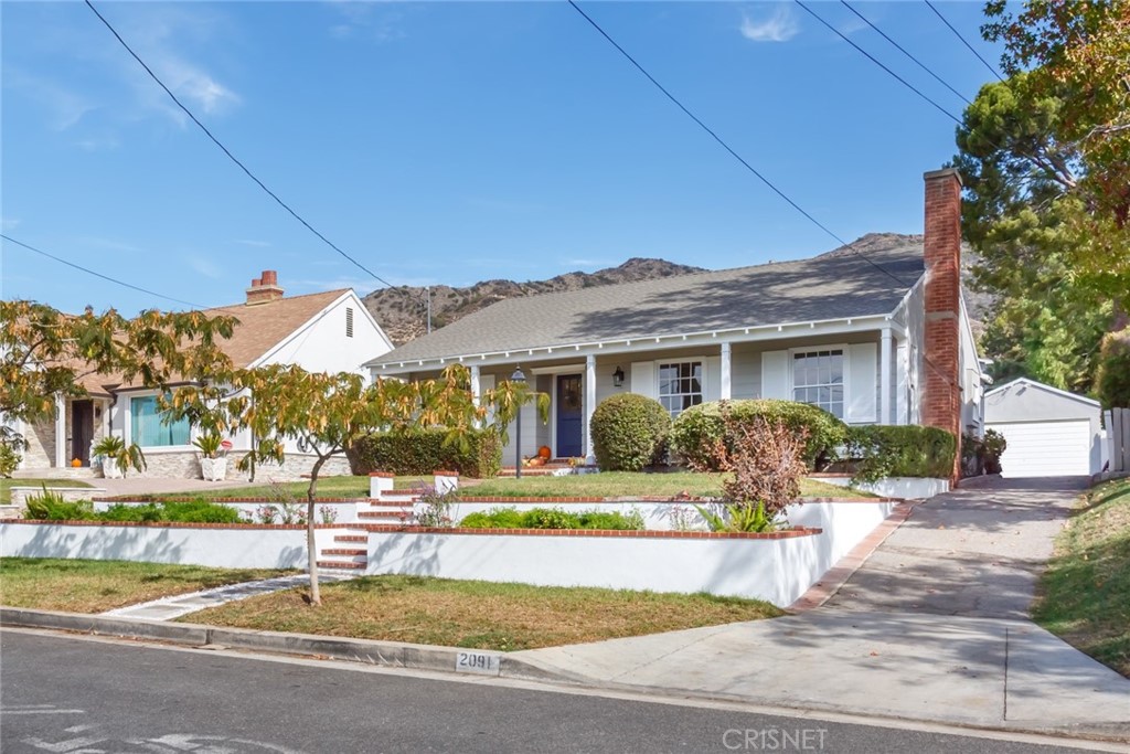 2091 West Mountain Street Glendale, CA 91201 - Photo 2 of 60 a front view of a house with swimming pool