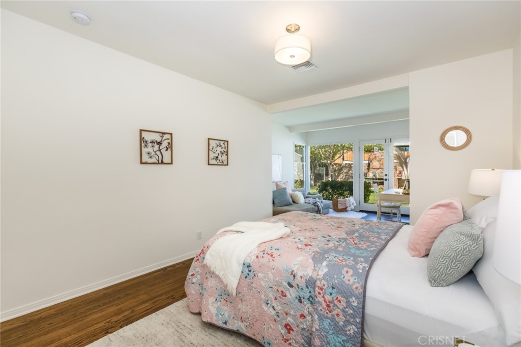 2091 West Mountain Street Glendale, CA 91201 - Photo 26 of 60 a bedroom with a bed and wooden floor