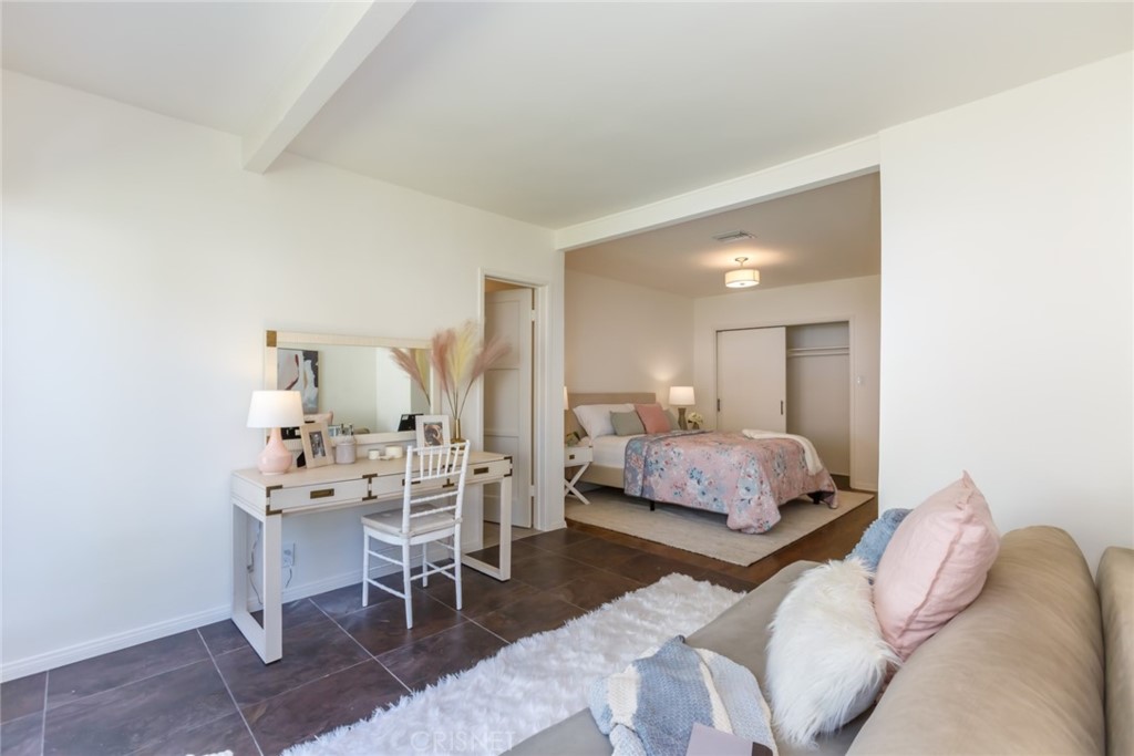 2091 West Mountain Street Glendale, CA 91201 - Photo 29 of 60 a bedroom with a bed a table and chair