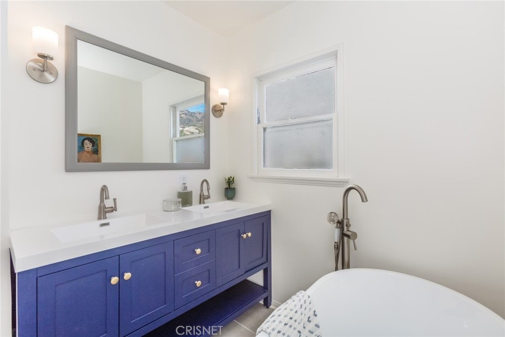 2091 West Mountain Street Glendale, CA 91201 - Photo 36 of 60 a bathroom with a toilet sink and mirror