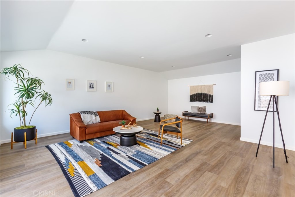 2091 West Mountain Street Glendale, CA 91201 - Photo 39 of 60 a living room with furniture and a wooden floor
