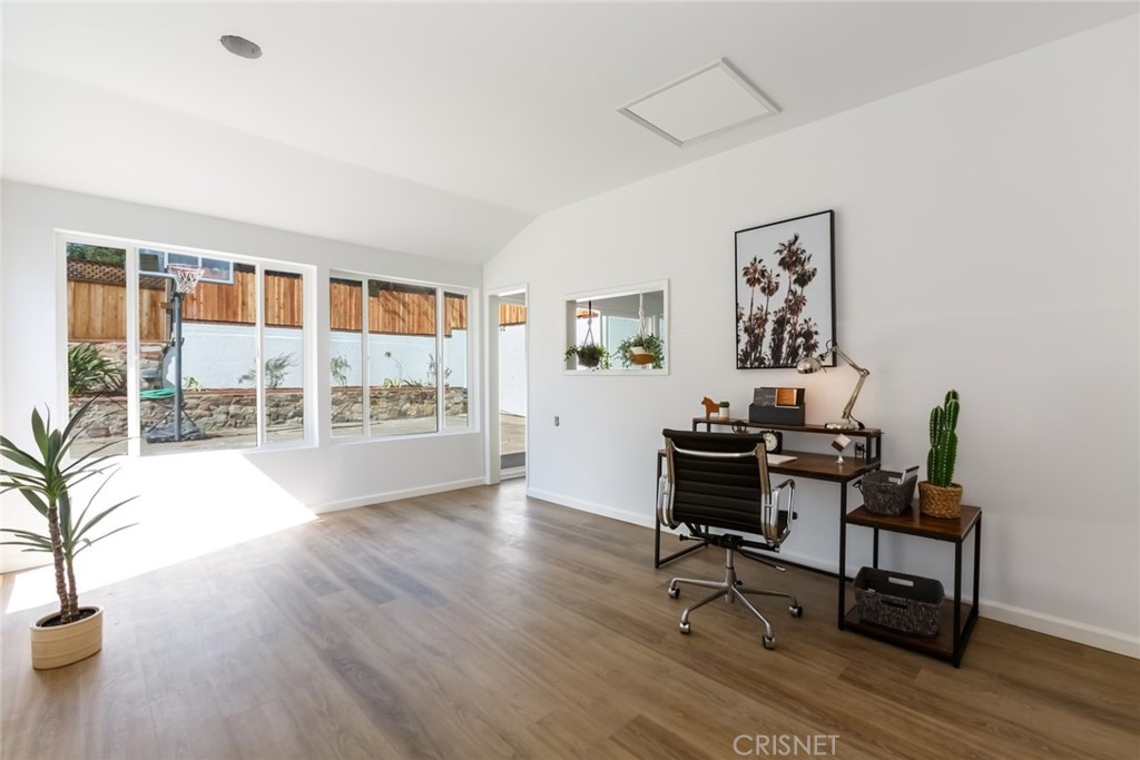 2091 West Mountain Street Glendale, CA 91201 - Photo 44 of 60 a view of a workspace with furniture and a potted plant