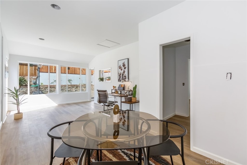2091 West Mountain Street Glendale, CA 91201 - Photo 45 of 60 a view of a dining room with furniture and a potted plant
