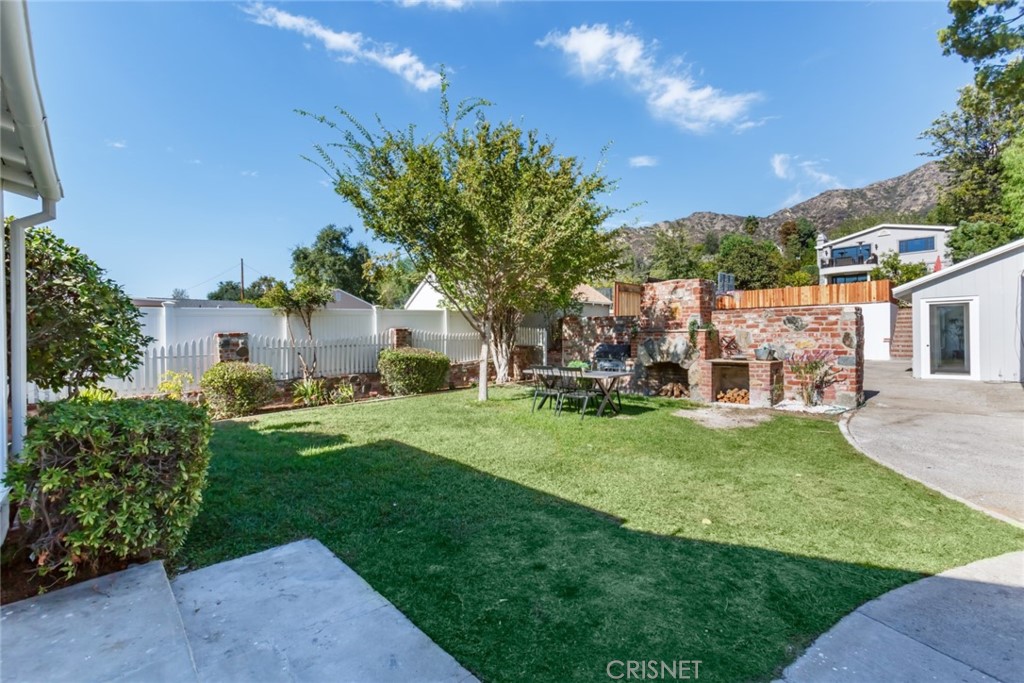 2091 West Mountain Street Glendale, CA 91201 - Photo 46 of 60 a front view of a house with a garden