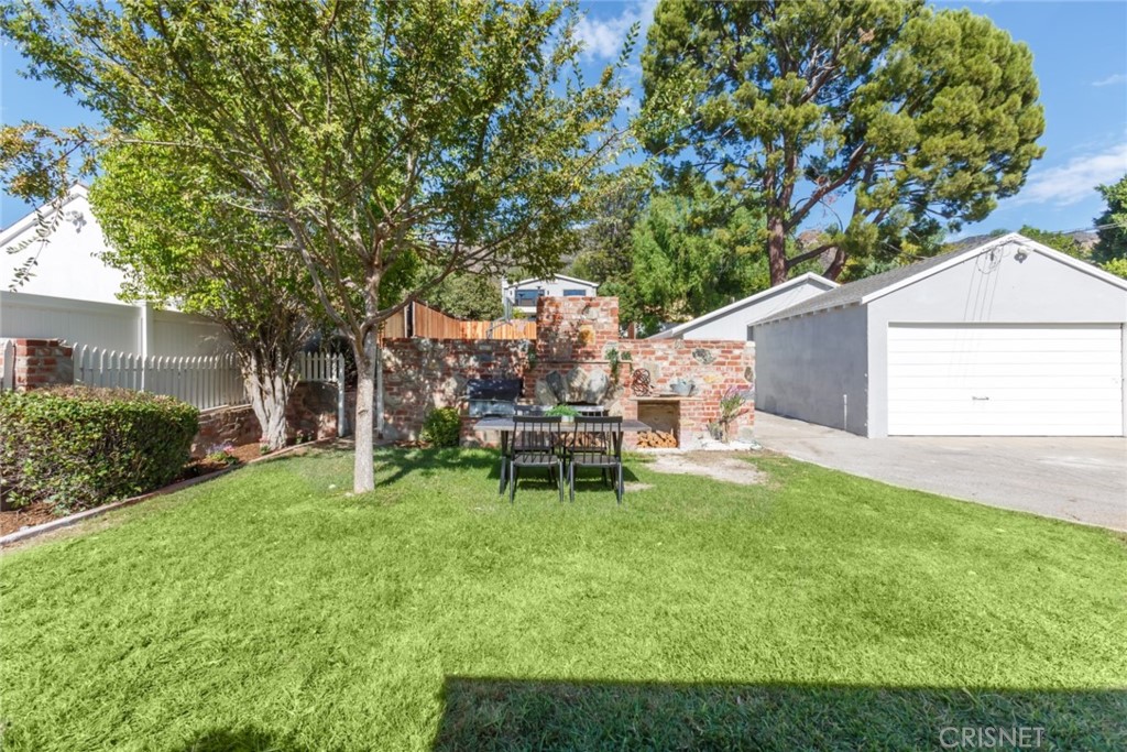 2091 West Mountain Street Glendale, CA 91201 - Photo 47 of 60 a view of a chair and table in backyard of the house