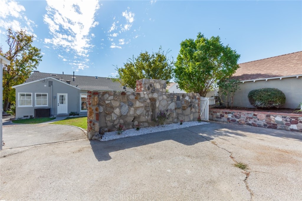 2091 West Mountain Street Glendale, CA 91201 - Photo 52 of 60 a front view of a house with a yard and garage