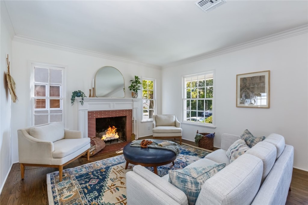 2091 West Mountain Street Glendale, CA 91201 - Photo 10 of 60 a living room with furniture and a fireplace
