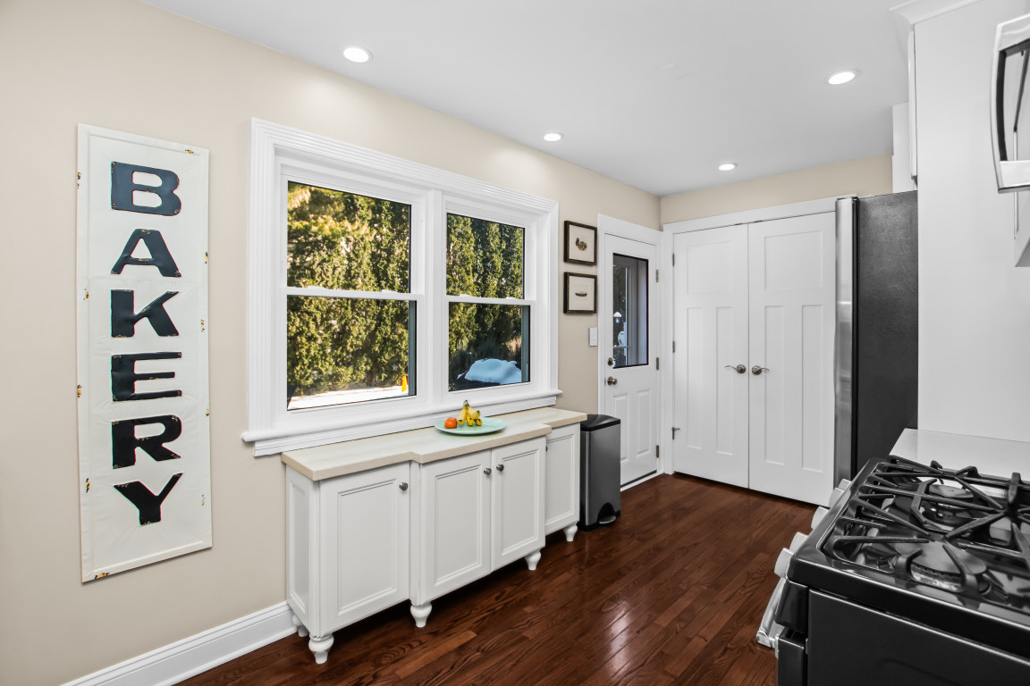606 5th Street, Unit 606 Wilmette, IL 60091 - Photo 7 of 14 a kitchen with stainless steel appliances a stove and a window