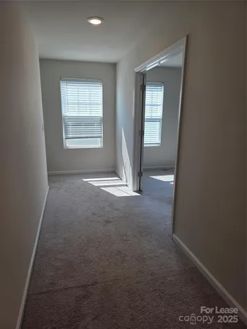 an empty room that has a window in it