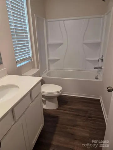 a bathroom with a sink a toilet and a bathtub