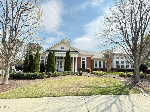 a view of a livingroom with furniture and a large window
