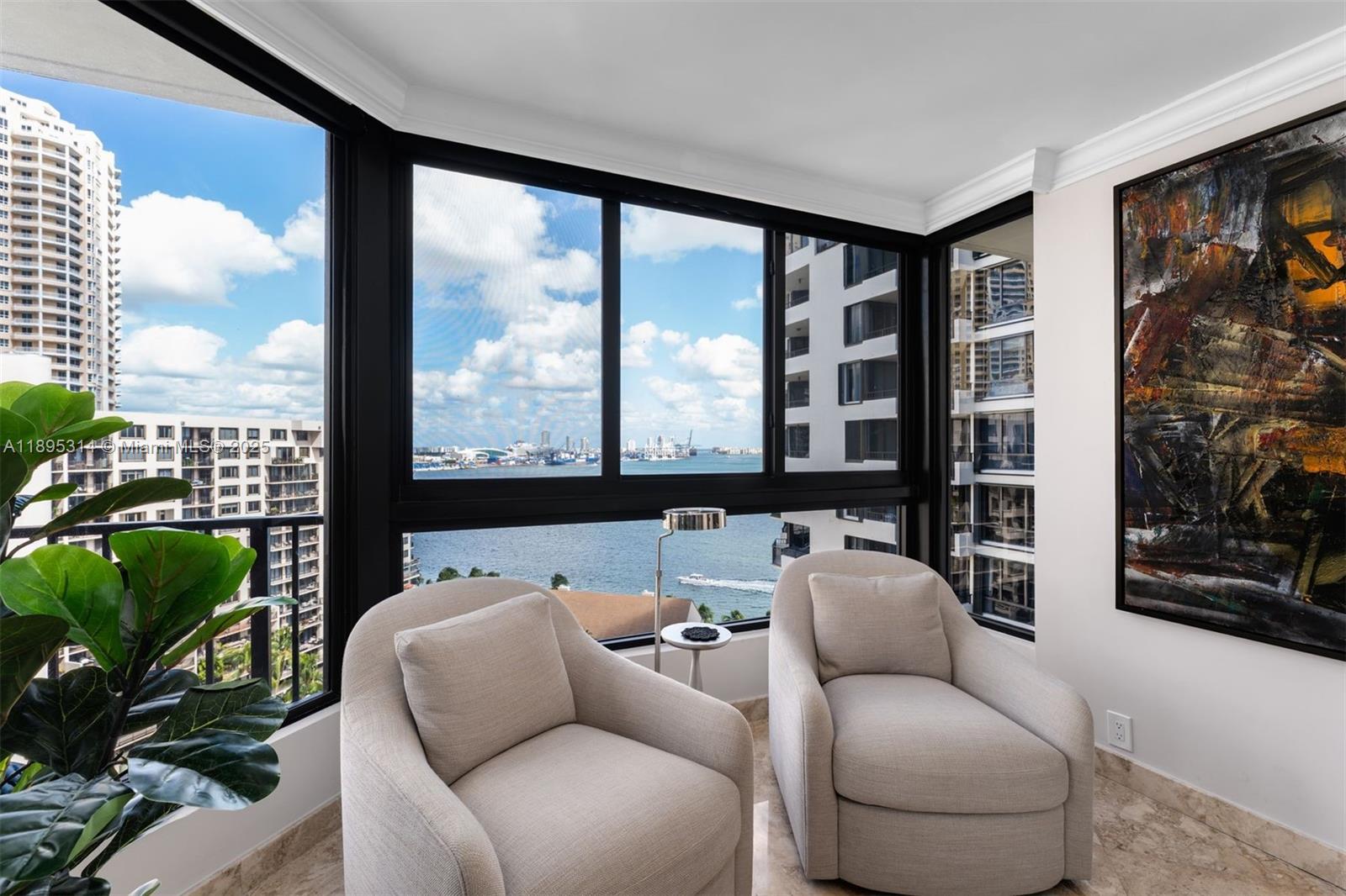 520 Brickell Key Drive, Unit A1716 Miami, FL 33131 - Photo 12 of 29 a living room with furniture and a floor to ceiling window