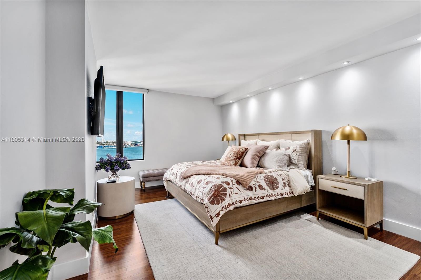 520 Brickell Key Drive, Unit A1716 Miami, FL 33131 - Photo 17 of 29 a spacious bedroom with a bed and a couch