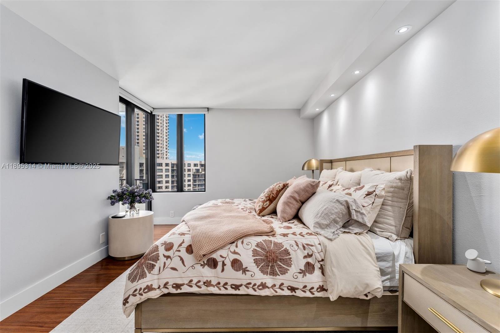 520 Brickell Key Drive, Unit A1716 Miami, FL 33131 - Photo 18 of 29 a bedroom with a bed and a flat screen tv