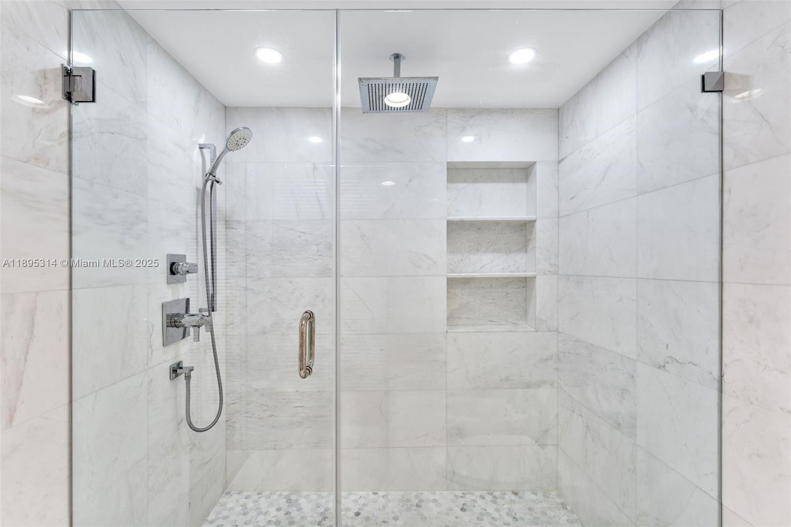 520 Brickell Key Drive, Unit A1716 Miami, FL 33131 - Photo 20 of 29 a bathroom with a shower