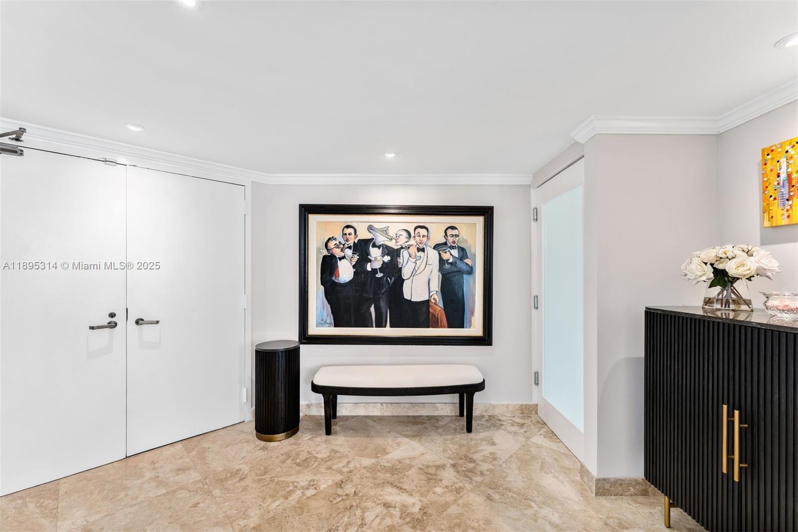 520 Brickell Key Drive, Unit A1716 Miami, FL 33131 - Photo 2 of 29 a bench sitting in a room next to a window