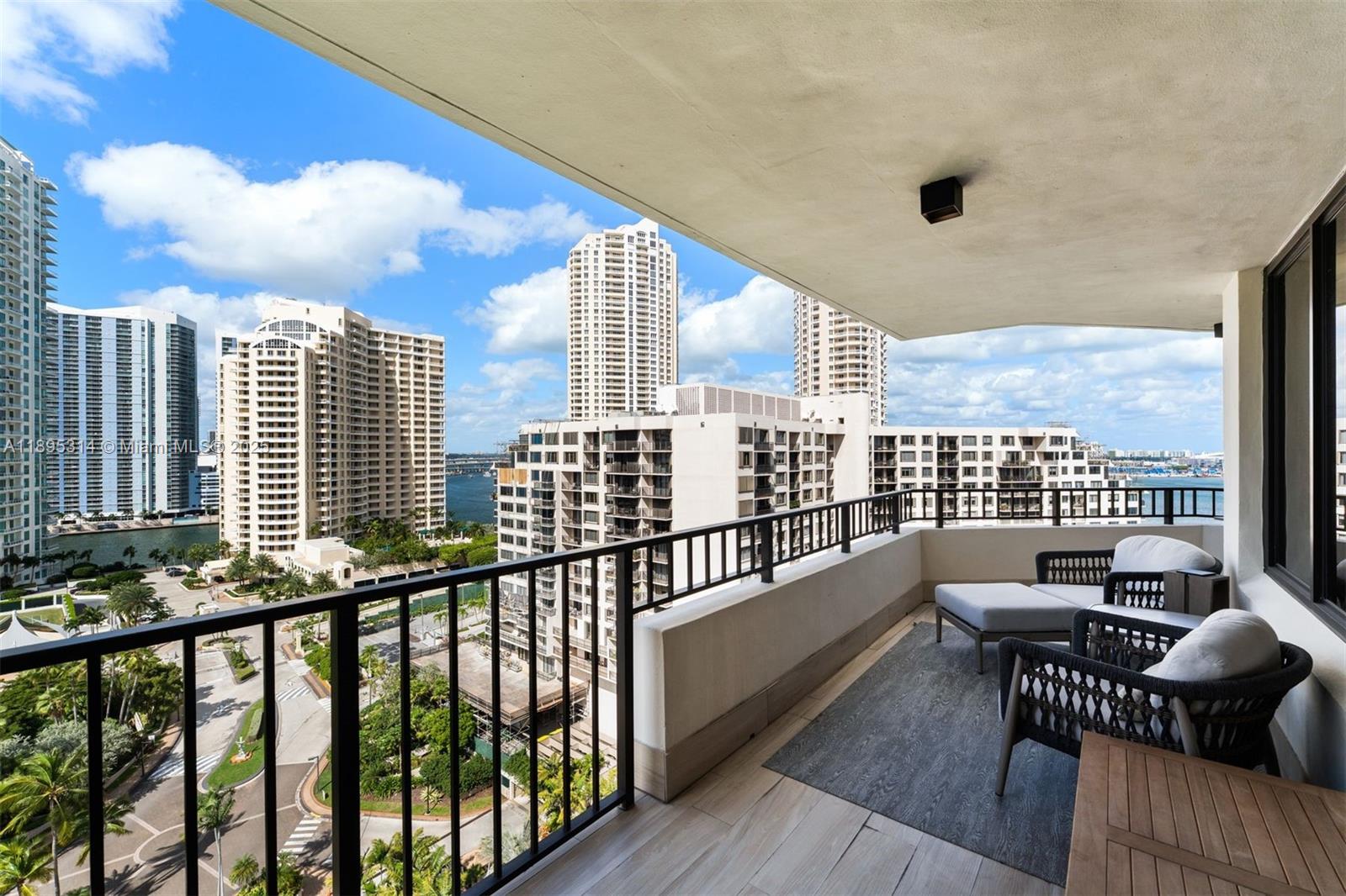 520 Brickell Key Drive, Unit A1716 Miami, FL 33131 - Photo 24 of 29 a view of a balcony with wooden floor