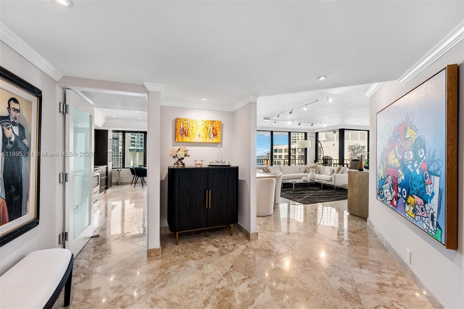 520 Brickell Key Drive, Unit A1716 Miami, FL 33131 - Photo 3 of 29 a living room with furniture and a flat screen tv