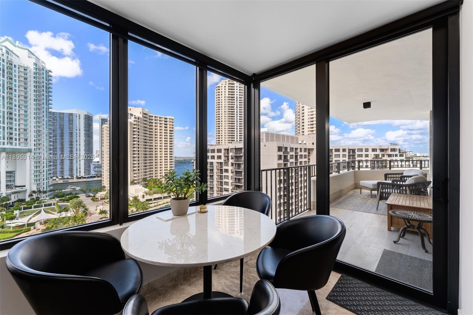520 Brickell Key Drive, Unit A1716 Miami, FL 33131 - Photo 7 of 29 a living room with furniture and a large window