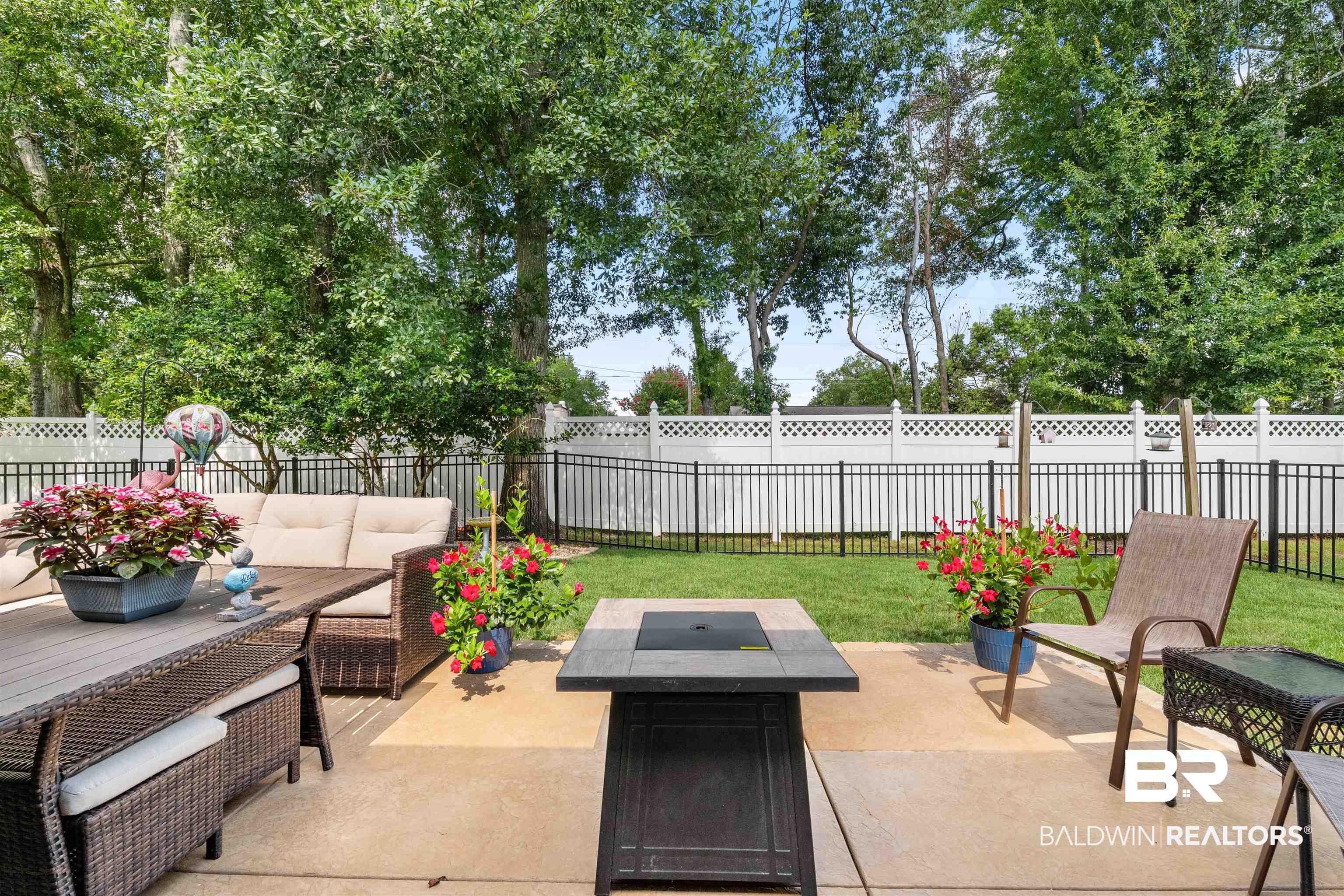 141 Mark Twain Loop Foley, AL 36535 - Photo 28 of 55 Fenced backyard featuring an outdoor living space with a fire pit and a patio area