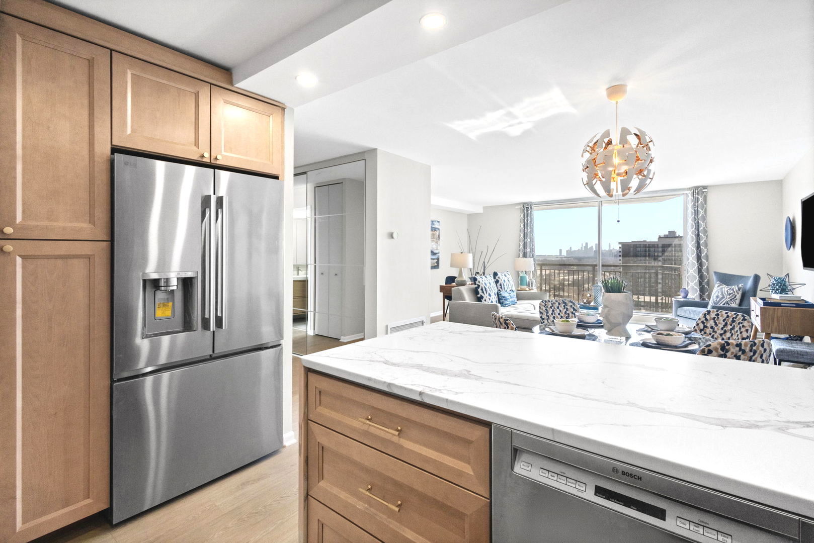 6007 North Sheridan Road, Unit 23G Chicago, IL 60660 - Photo 6 of 22 a kitchen with refrigerator and window