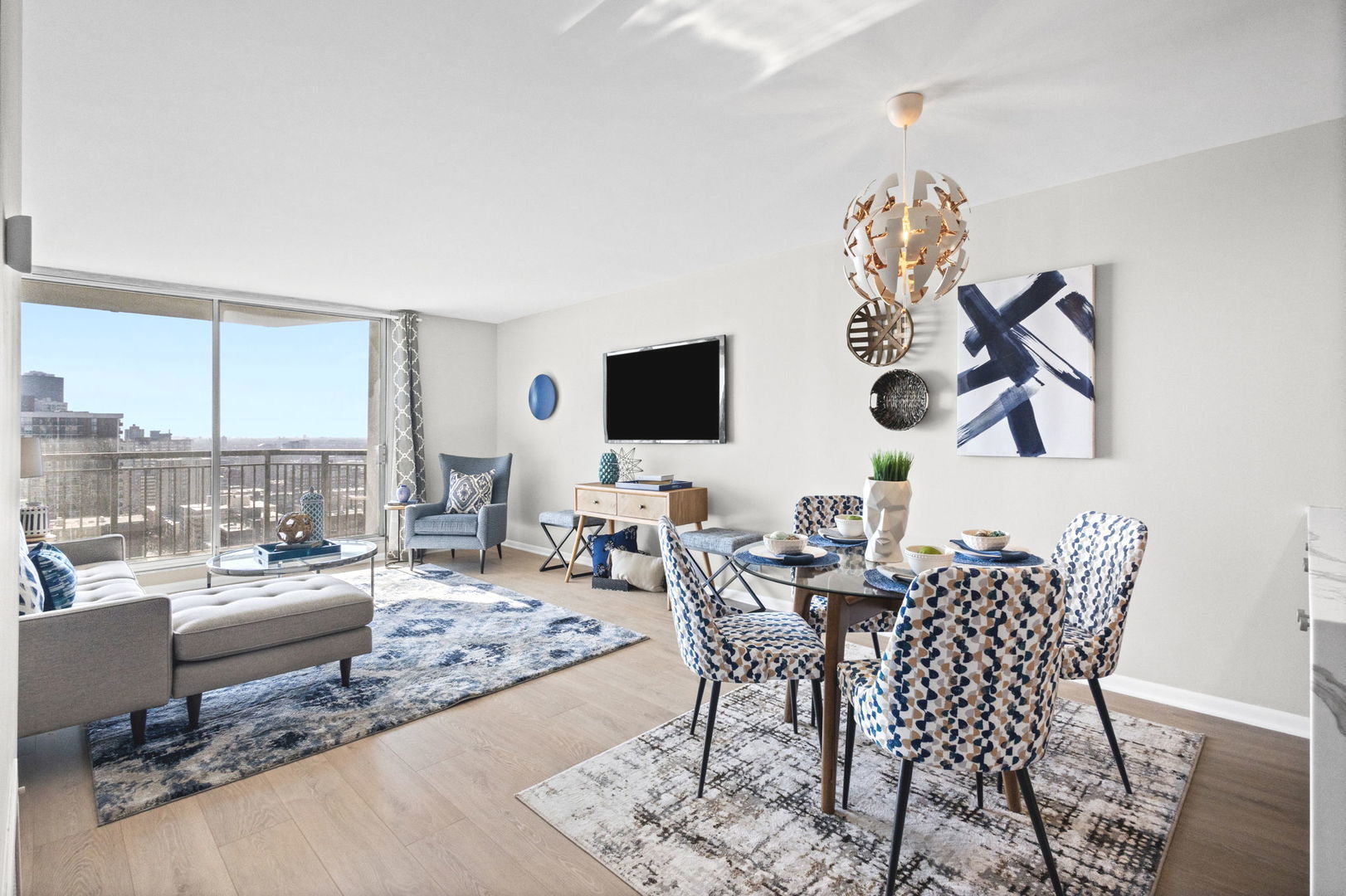 6007 North Sheridan Road, Unit 23G Chicago, IL 60660 - Photo 7 of 22 a view of a livingroom with furniture and a floor to ceiling window