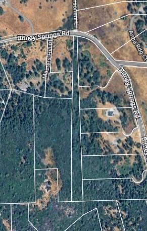 12042 Bitney Springs Road Nevada City, CA 95959 - Photo 2 of 19 a bathroom with a glass shower door