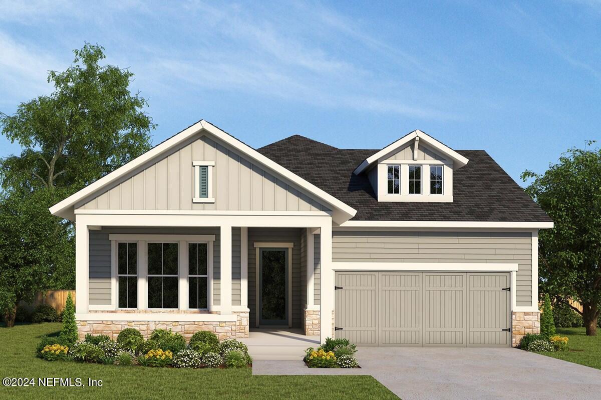 5614 Pathfinder Road Jacksonville, FL 32224 - Photo 1 of 1 a front view of a house with a yard and garage