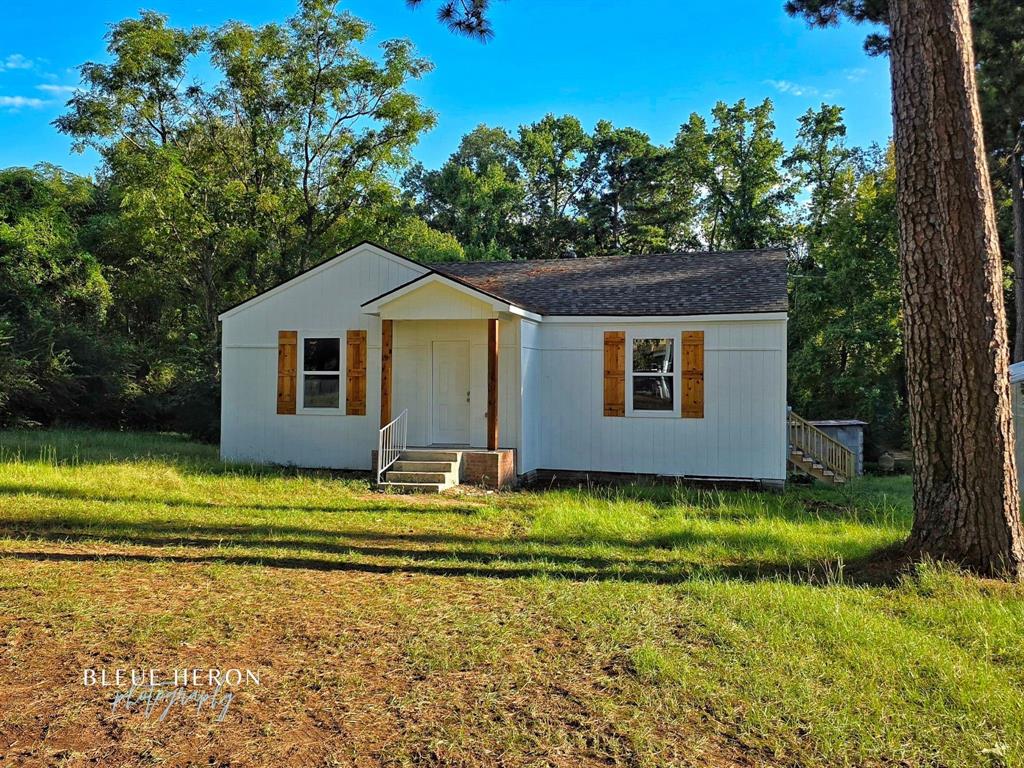 5497 Jefferson Paige Road Shreveport, LA 71119 - Photo 1 of 11 a view of a house with a yard