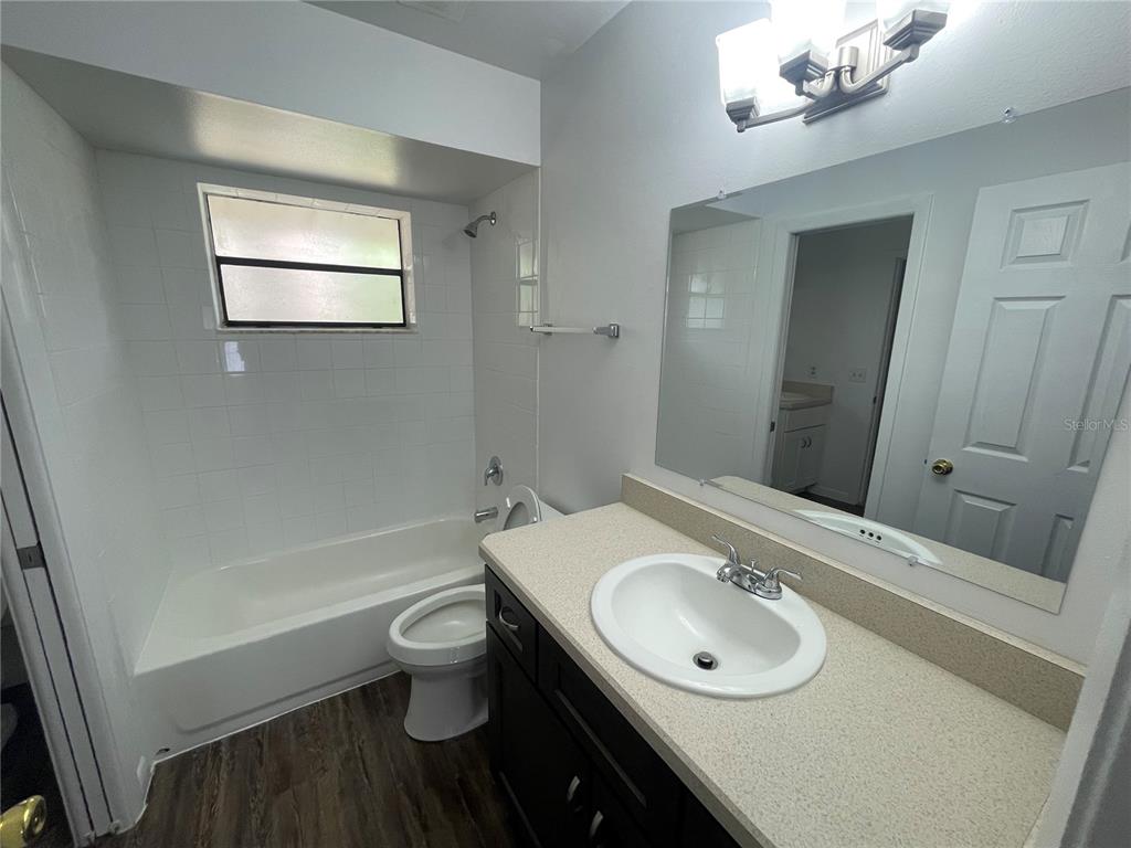 2355 Cypress Road DeLand, FL 32724 - Photo 11 of 14 a bathroom with a sink a toilet and shower