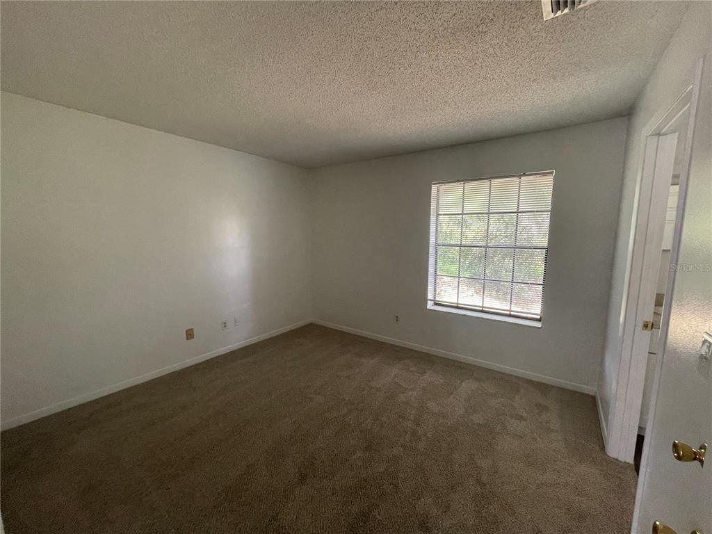 2355 Cypress Road DeLand, FL 32724 - Photo 12 of 14 an empty room with a window