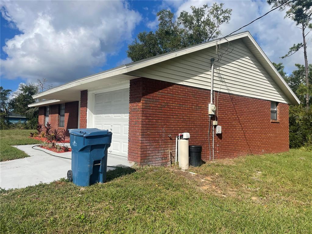 2355 Cypress Road DeLand, FL 32724 - Photo 3 of 14 a front view of a house with garden