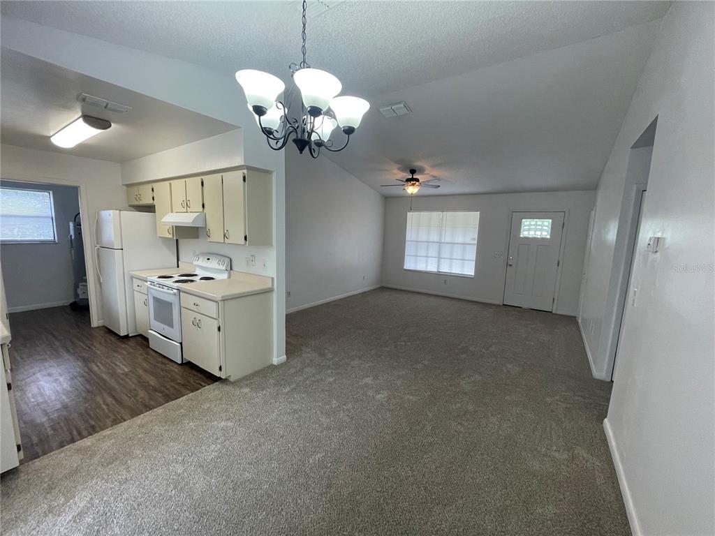 2355 Cypress Road DeLand, FL 32724 - Photo 7 of 14 a view of a room with cabinet and chandelier