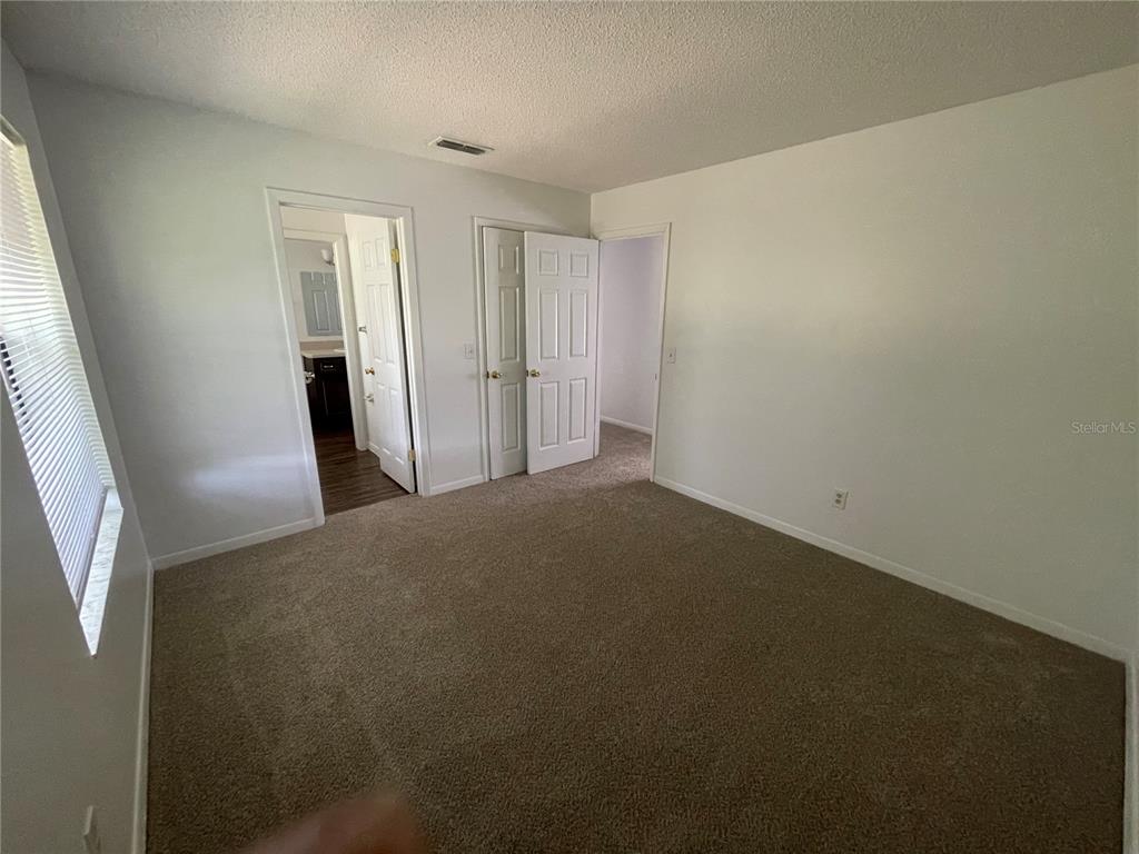 2355 Cypress Road DeLand, FL 32724 - Photo 9 of 14 a view of a livingroom with an empty space and a window