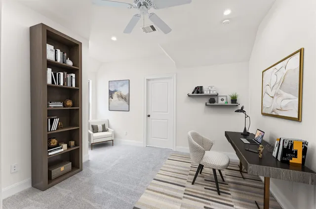 a living room with furniture and a book shelf
