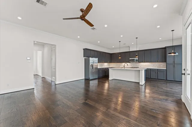 a view of kitchen with wooden floor and window