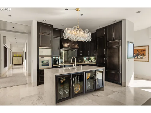 a kitchen with a refrigerator and a sink