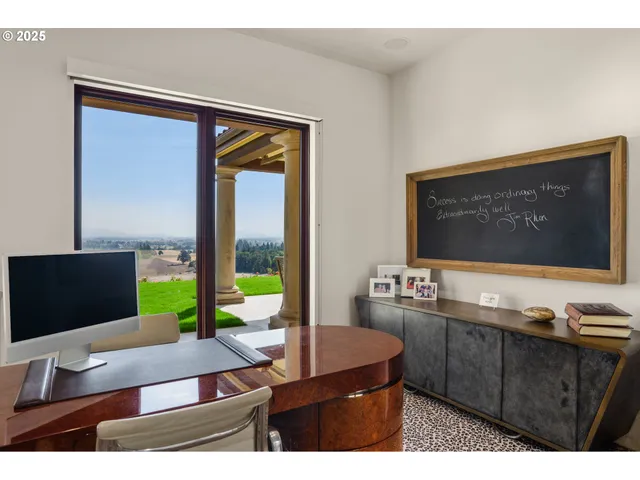 a living room with couch flat screen tv and floor to ceiling window