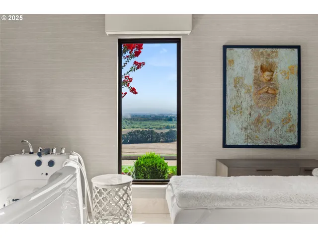 a living room with furniture and a painting