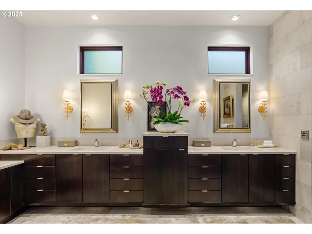 a bathroom with a sink vanity and a mirror