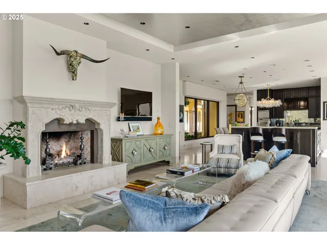 a living room with furniture flat screen tv and a fireplace