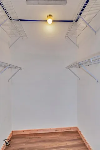 a view of a room with racks on the wall