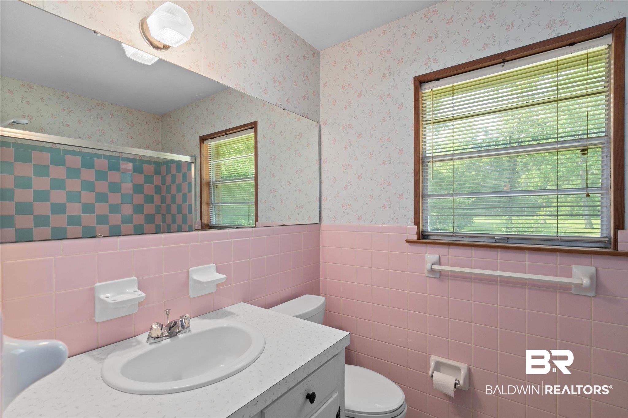 423 First Avenue Saraland, AL 36571 - Photo 12 of 20 Bathroom with a tile shower, toilet, tile walls, vanity, and wainscoting
