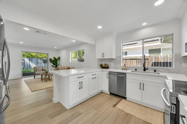 a bedroom with a bed and painting on the wall