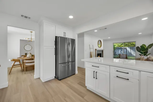 a bedroom with a bed dresser and a window