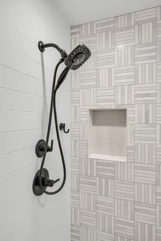 a bathroom with a toilet a sink and a mirror